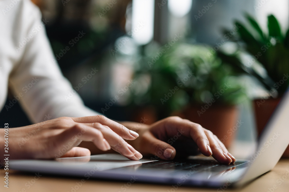 Person typing on a laptop